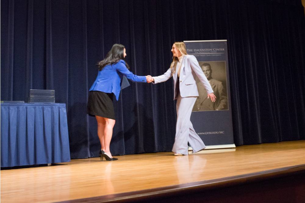 Image 1 of 24 megan shaking hands with hannah